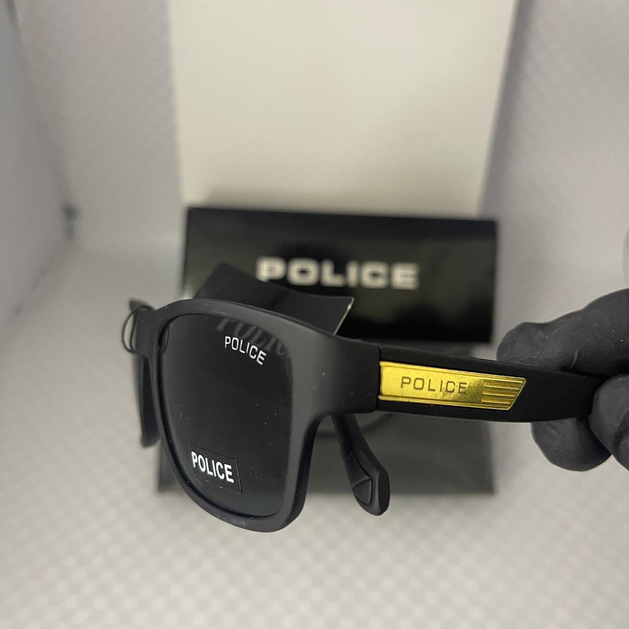 The golden side detail with “POLICE”